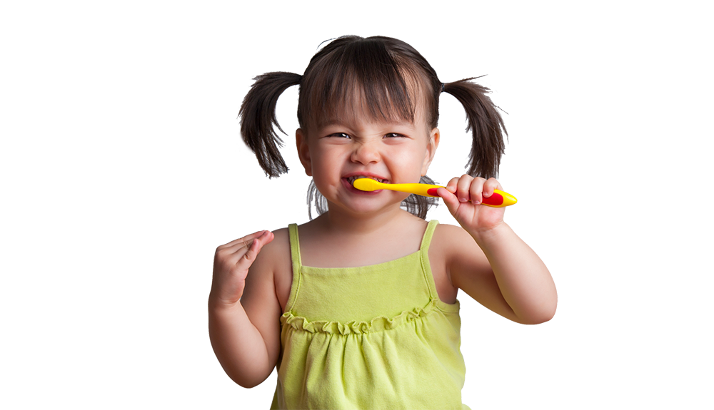Little Girl brushing teeth at pediatric dentist